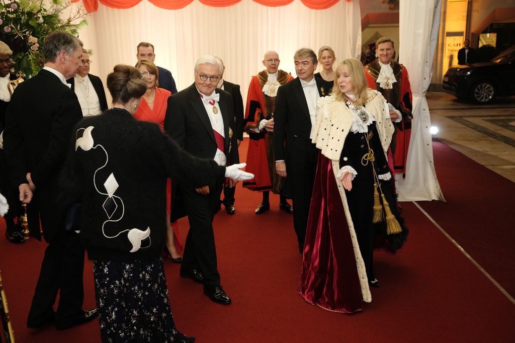 LONDON, ENGLAND - DECEMBER 4: The Princess Royal gestures towards the Lady Mayor of London Dame Susan Langley and the President of the Federal Republic of Germany Frank-Walter Steinmeier and his wife Elke Budenbender, as the president arrives at the Guildhall for a banquet on day two of their state visit to the UK on December 4, 2025 in London, England. (Photo Jeff Moore - Pool/Getty Images)