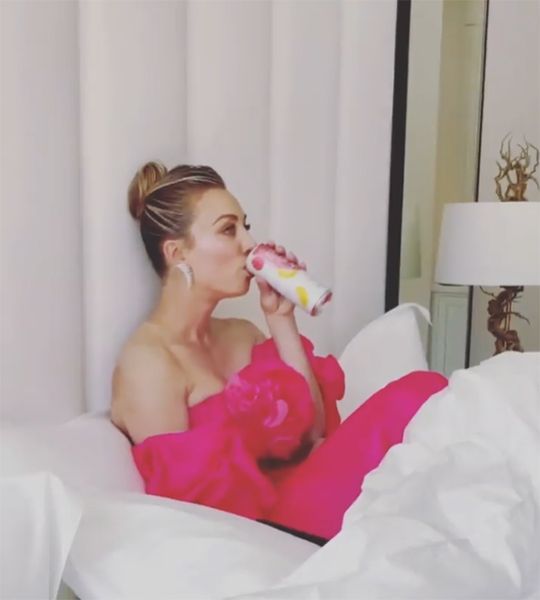 kaley cuoco pink dress in bed