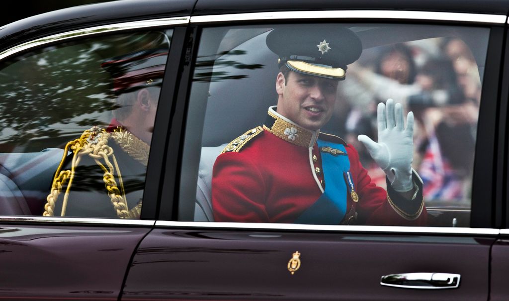Prince William waving in the car on his wedding day