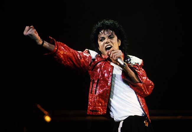 Michael Jackson in red jacket on stage in 1986