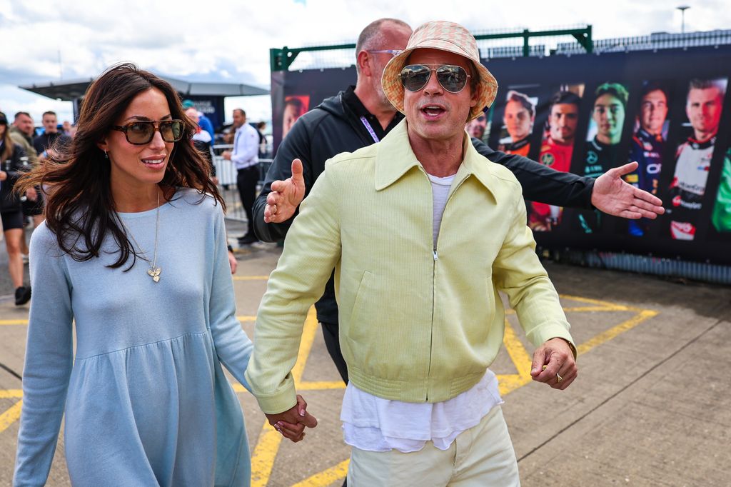 Brad Pitt, star of upcoming 'F1' movie, arrives in the paddock with girlfriend Ines de Ramon during the F1 Grand Prix of Great Britain at Silverstone Circuit on July 7, 2024 in Northampton, United Kingdom.