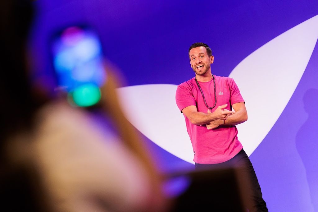 Charlie speaking on stage in Jordan