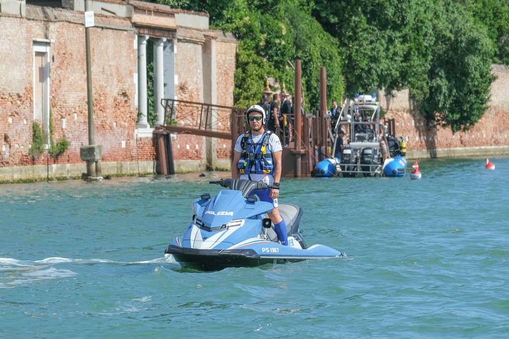 Italian police guard the island of San Giorgio Maggiore during the wedding 