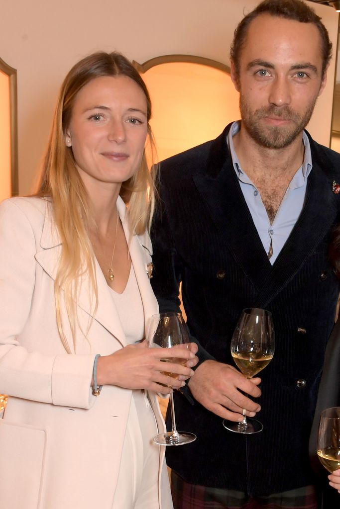 Alizee Middleton in a white suit with her husband James Middleton in a blue shirt and black jacket