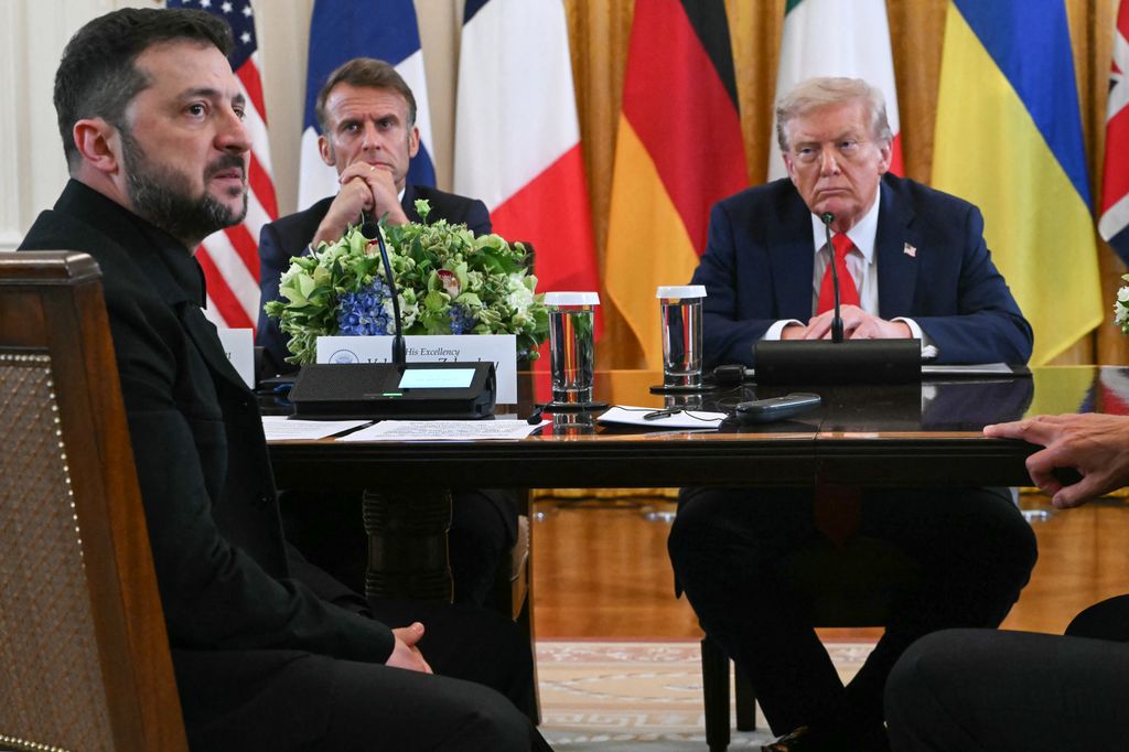 French President Emmanuel Macron (2L) and US President Donald Trump (R) listen to Ukrainian President Volodymyr Zelensky speak during a meeting with European leaders in the East Room of the White House in Washington, DC, on August 18, 2025