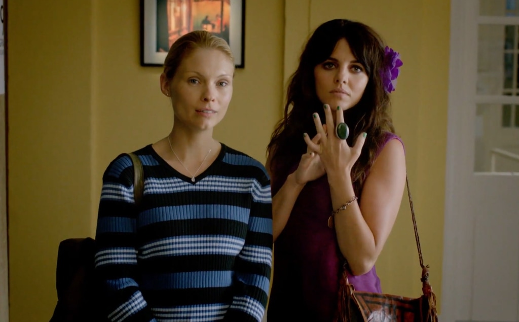 two women standing in house