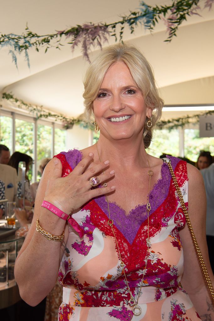 Penny Lancaster in a pink and red dress