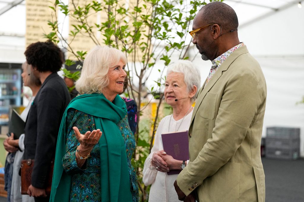 Queen Camilla speaking with Sir Lenny Henry and Dame Jacqueline Wilson