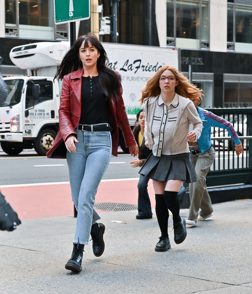 NEW YORK, NEW YORK - OCTOBER 11:  Dakota Johnson and Sydney Sweeney are seen on the set of "Madame Web" on 42nd Street on October 11, 2022 in New York City. (Photo by James Devaney/GC Images)
