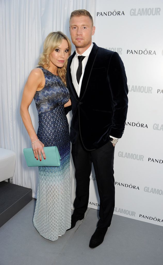 husband and wife posing at awards 