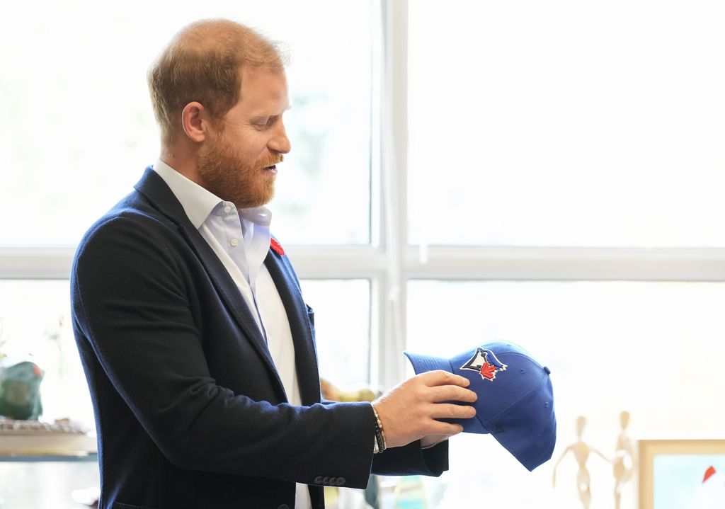 Prince Harry received a Toronto Blue Jays hat as he met with veterans on November 6