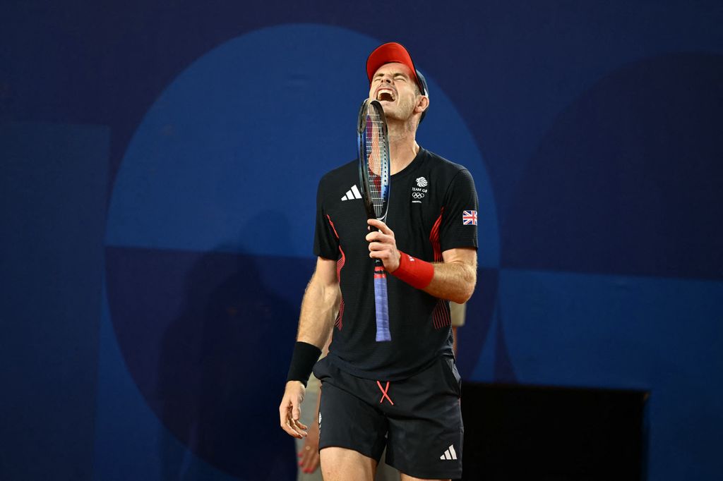 Andy Murray grimacing while holding a tennis racquet