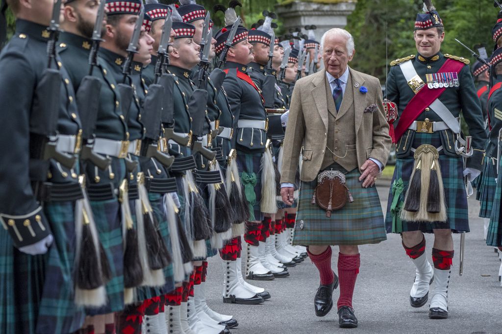 King Charles inspects guard of honour at Balmoral