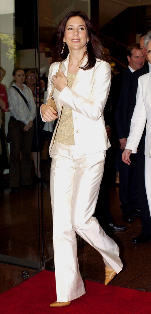Crown Princess Mary Of Denmark in a white silk suit