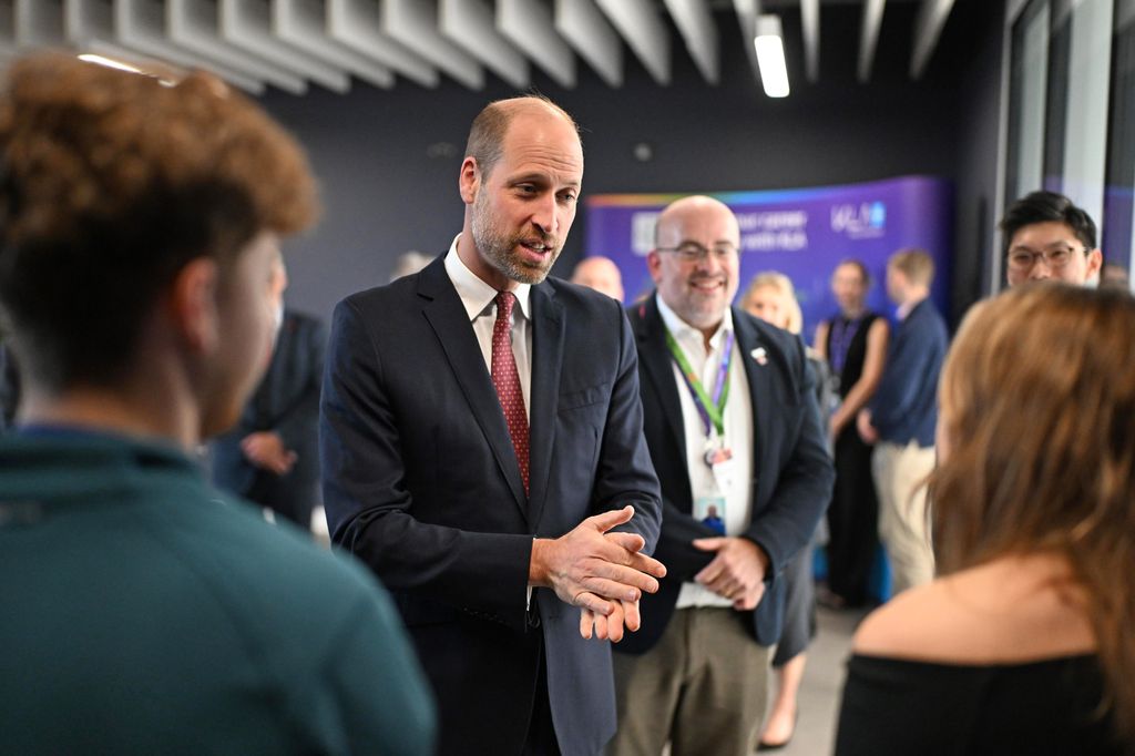 Prince William talks to employees during a visit at the semiconductor manufacturer SPTS, a division of KLA