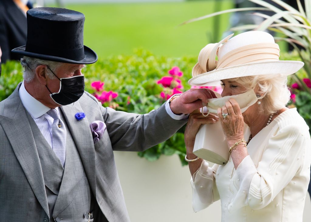 King Charles helps Camilla with her face mask