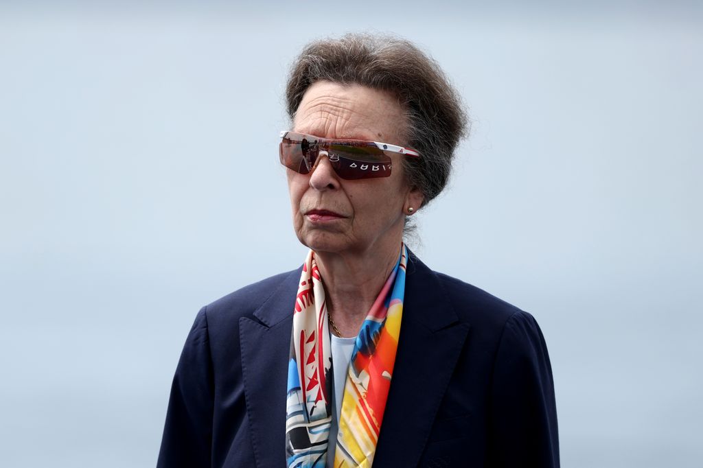 Princess Anne in a navy blue outfit and sunglasses