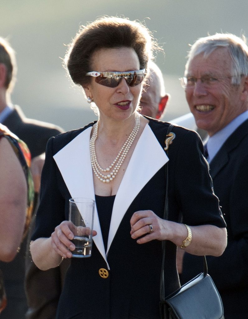 Princess Anne in a black blazer dress and sunglasses