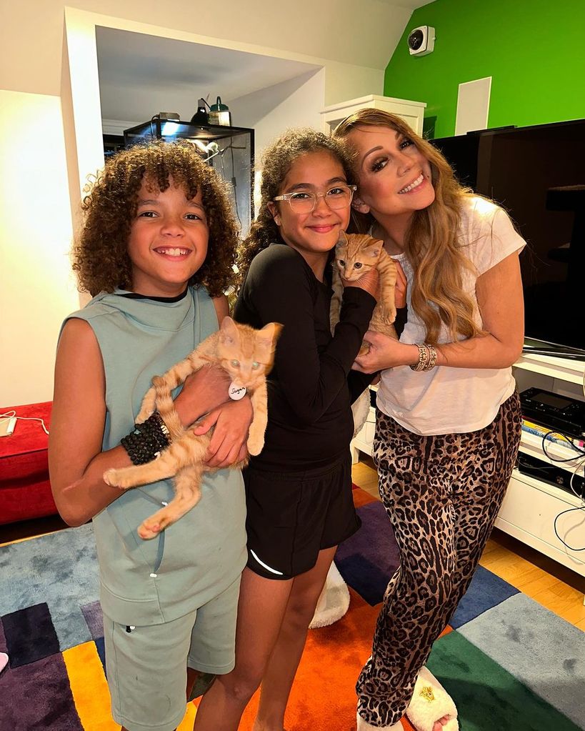 Mariah with her twins and their new furry friends