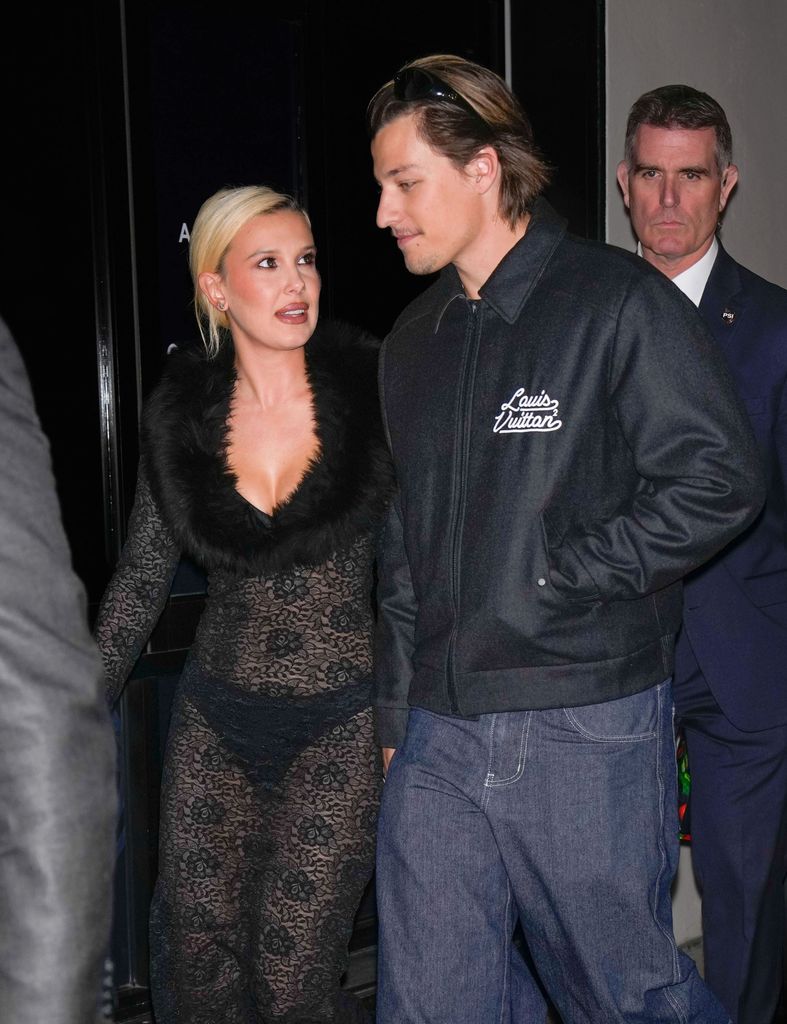 Millie Bobby Brown  in lace dress and Jake Bongiovi in bomber jacket in New York 