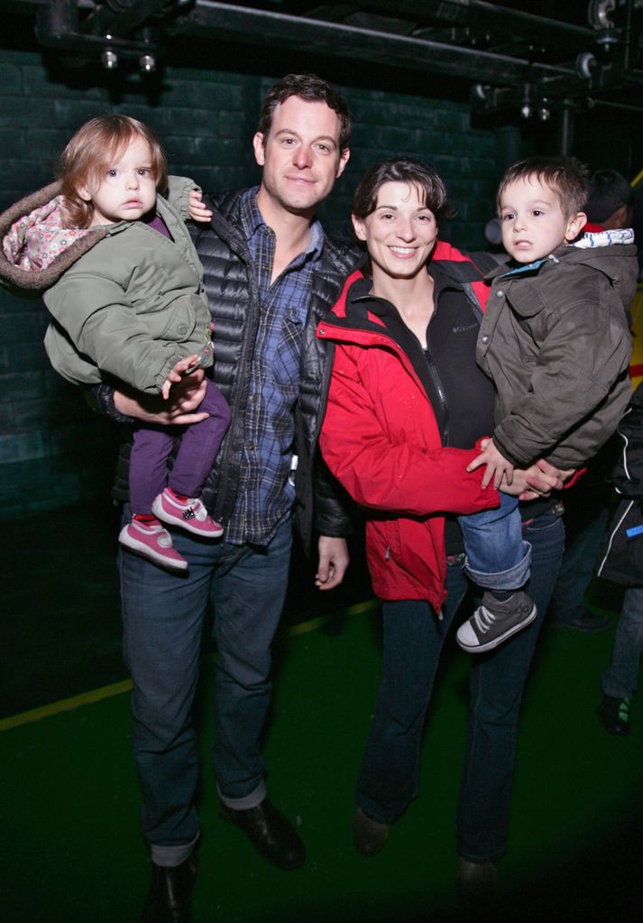 Matt Baker and wife Nicola holding two young children