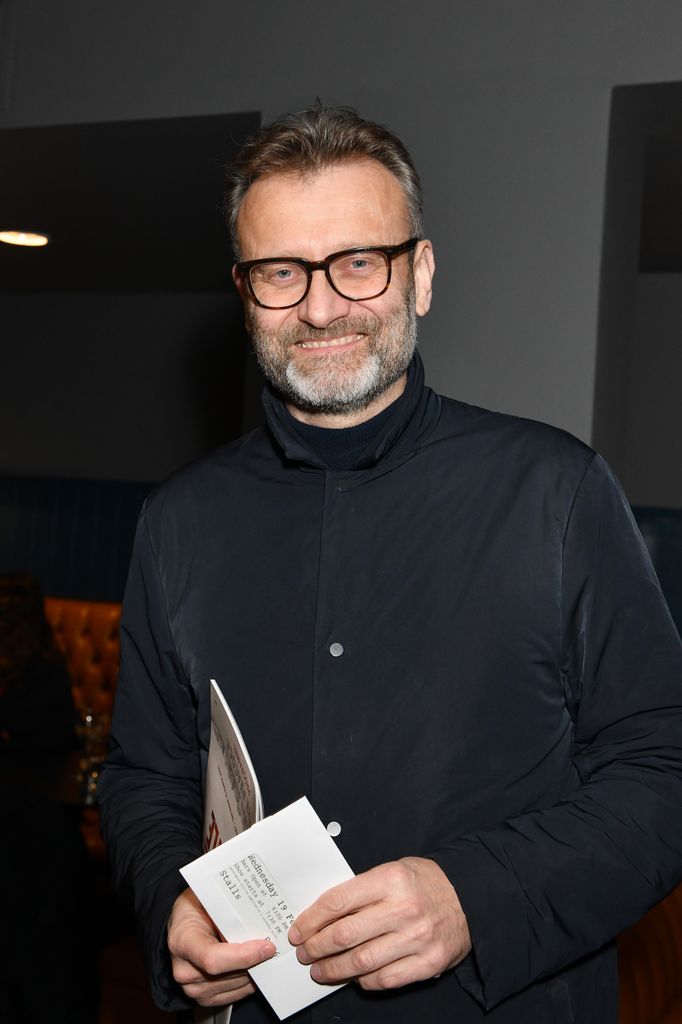 Hugh Dennis in a black outfit