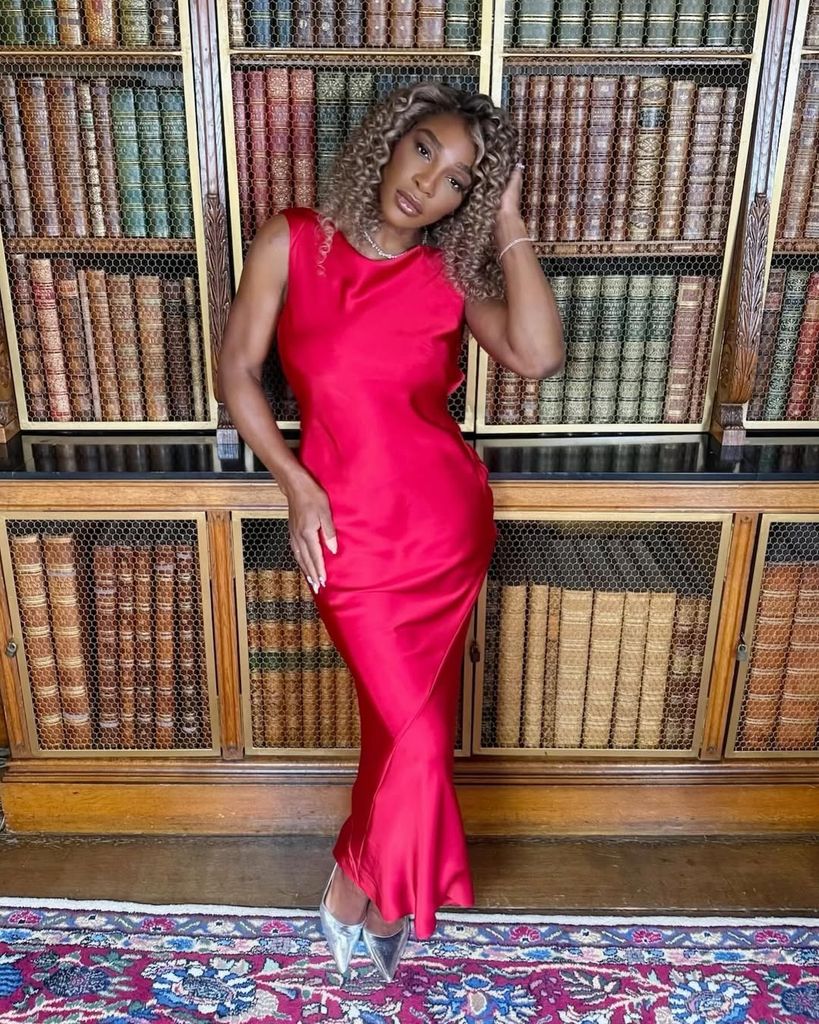 Serena Williams posing in a red dress