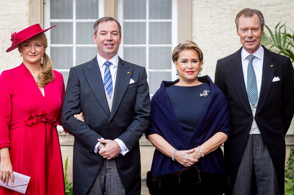 Grand Duchess Stephanie of Luxembourg, Grand Duke Guillaume of Luxembourg, Grand Duchess Maria Teresa of Luxembourg and Grand Duke Henri of Luxembourg stand in a line