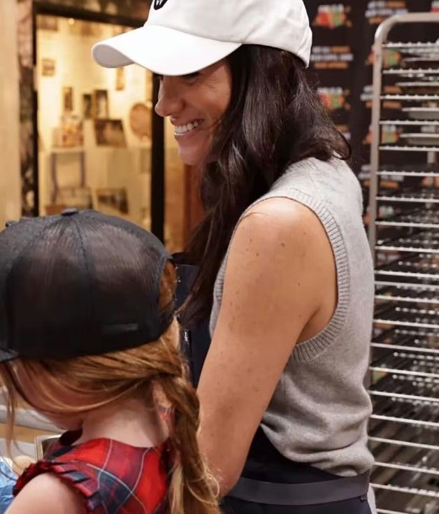 Meghan looked as proud as punch with her daughter Lilibet making cookies
