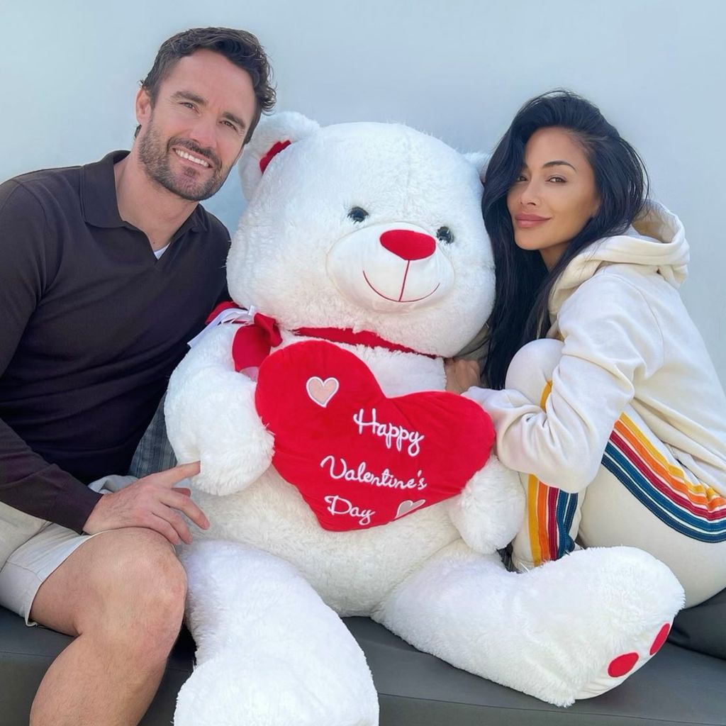 Nicole and Thom with a giant Valentine's Day bear