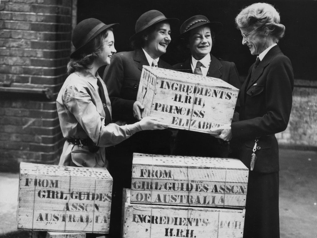 Miss Anderton, general secretary of Imperial headquarters, receiving a gift of ingredients for Princess Elizabeth's wedding cake