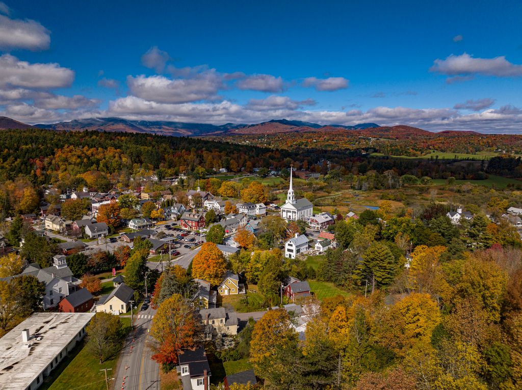 Elevated view of picture perfect Stowe Vermont in Autumn Color.