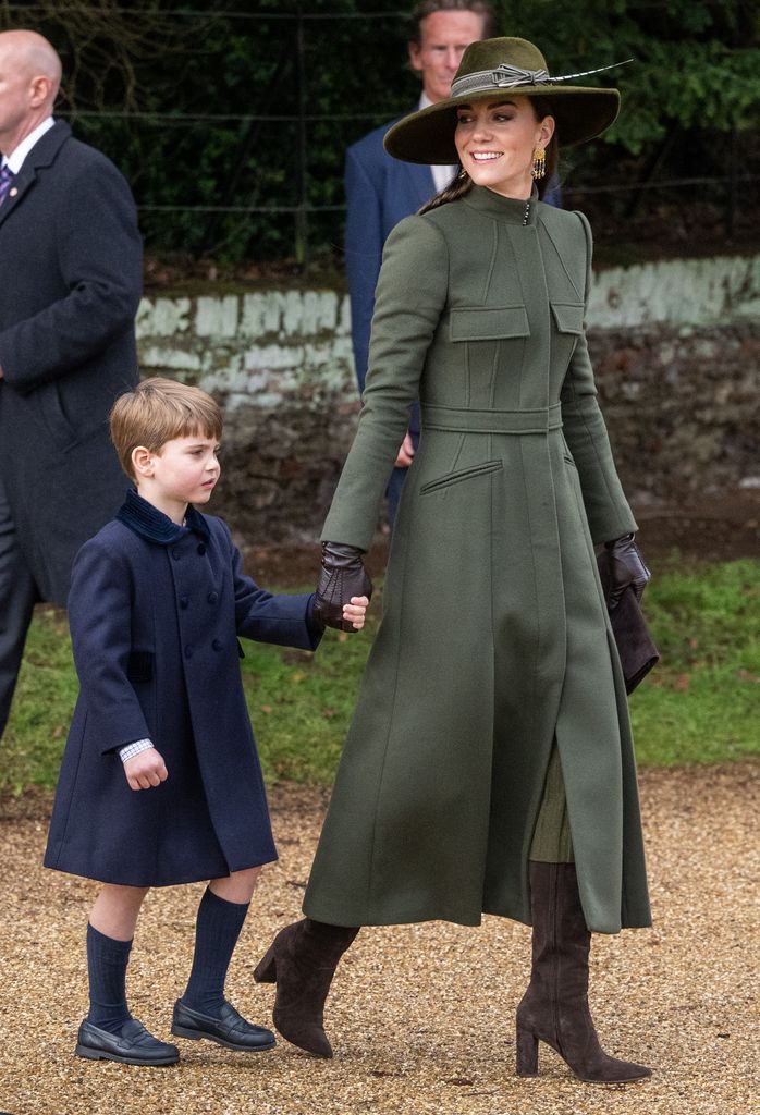 Prince Louis holding the Princess of Wales' hand