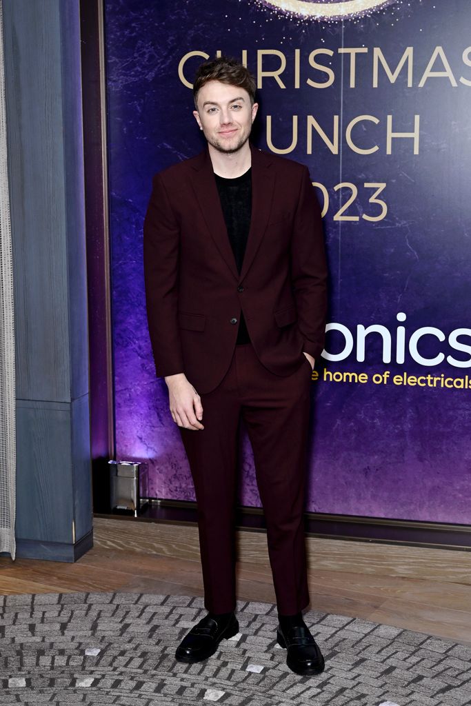 Roman Kemp in a burgundy suit