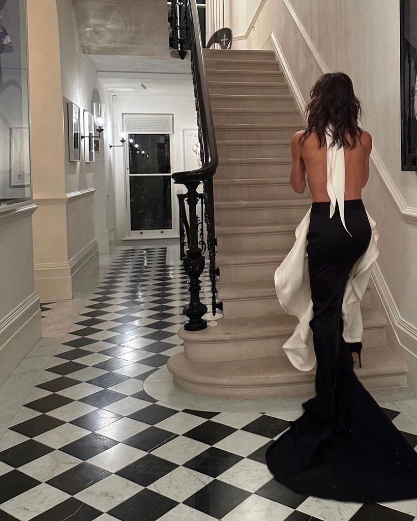 Victoria Beckham in a backless black and white dress inside her London home with David Beckham
