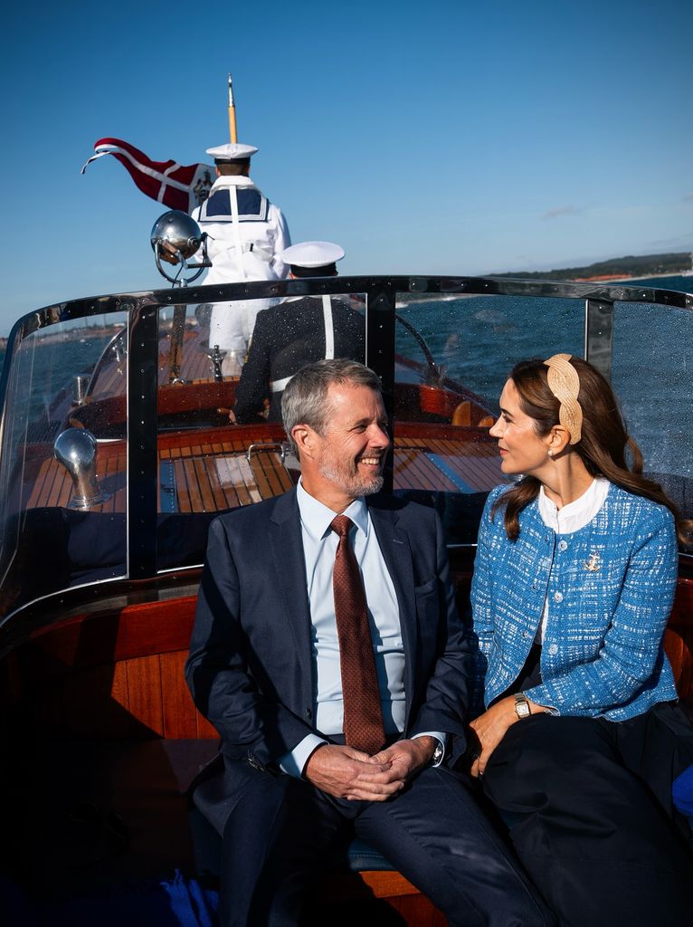 Queen Mary and King Frederik looking loved up as they boat around Denmark