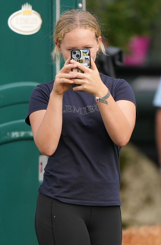 Savannah Phillips takes a picture as she supports her Aunt, Zara Tindall, at the Blenheim International Horse Trials at Blenheim Palace, Blenheim, Oxfordshire, UK, on the 21st September 2024.

Picture by James Whatling