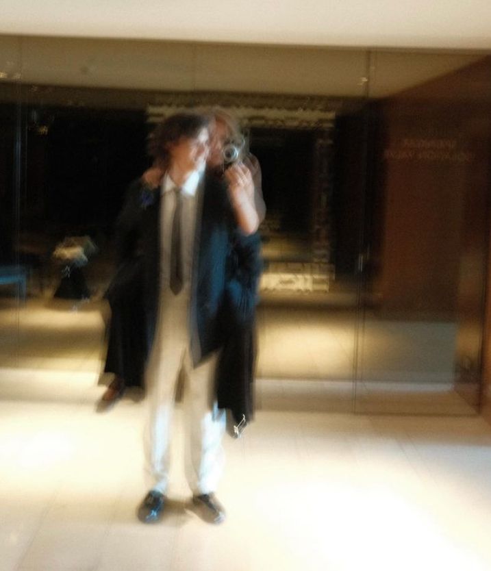 A blurry photo of Count Nikolai and Benedikte Thoustrup, who is on his back