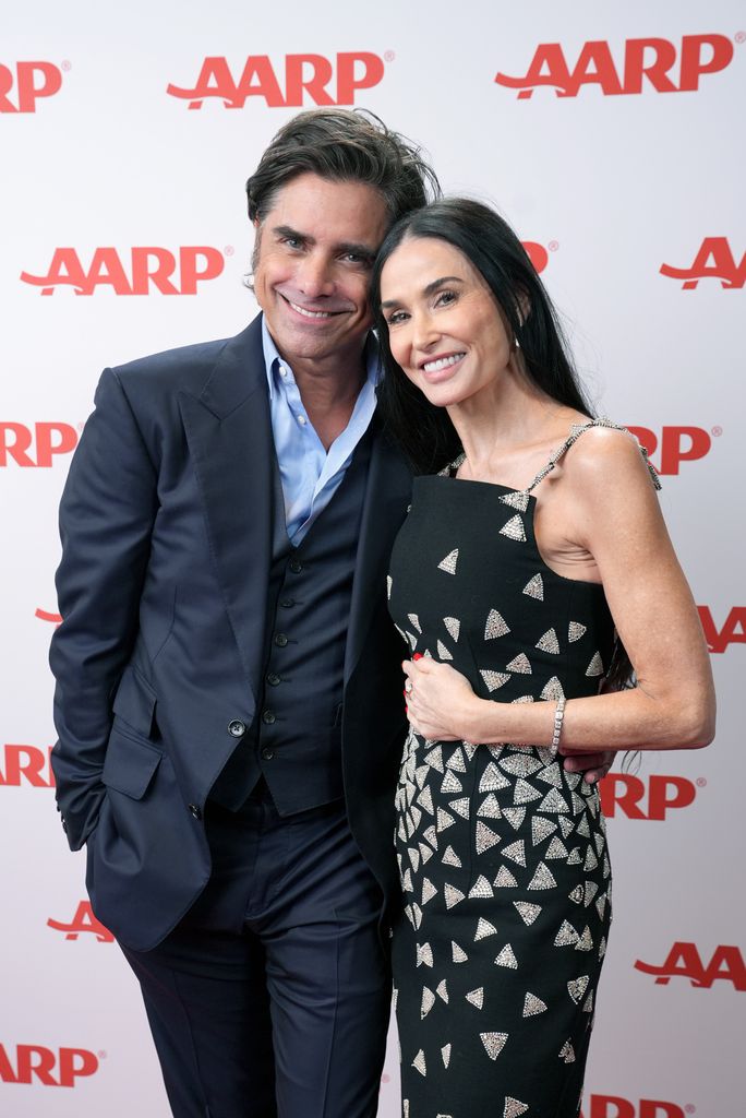 John Stamos and Demi Moore pose in the photo booth during AARP's Annual Movies For Grownups Awards at the Beverly Wilshire, A Four Seasons Hotel on February 08, 2025 in Beverly Hills, California