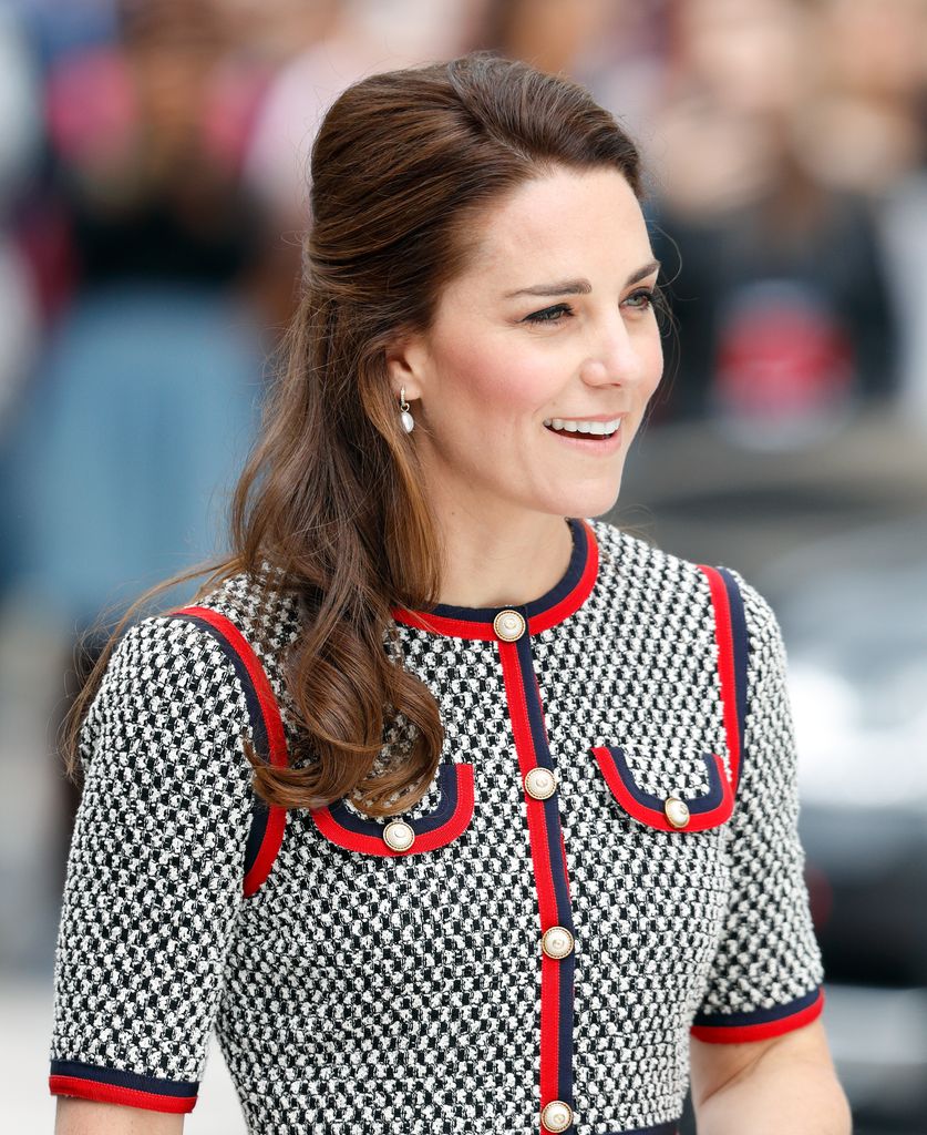 Catherine in houndstooth dress with red trim