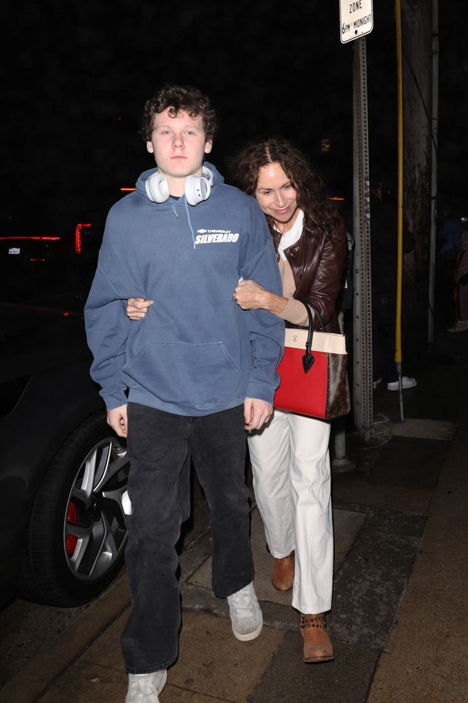 Minnie Driver shows affection as she puts her head on her son Henry Story Driver's shoulder as they step out for dinner at Italian restaurant Giorgio Baldi in Santa Monica.