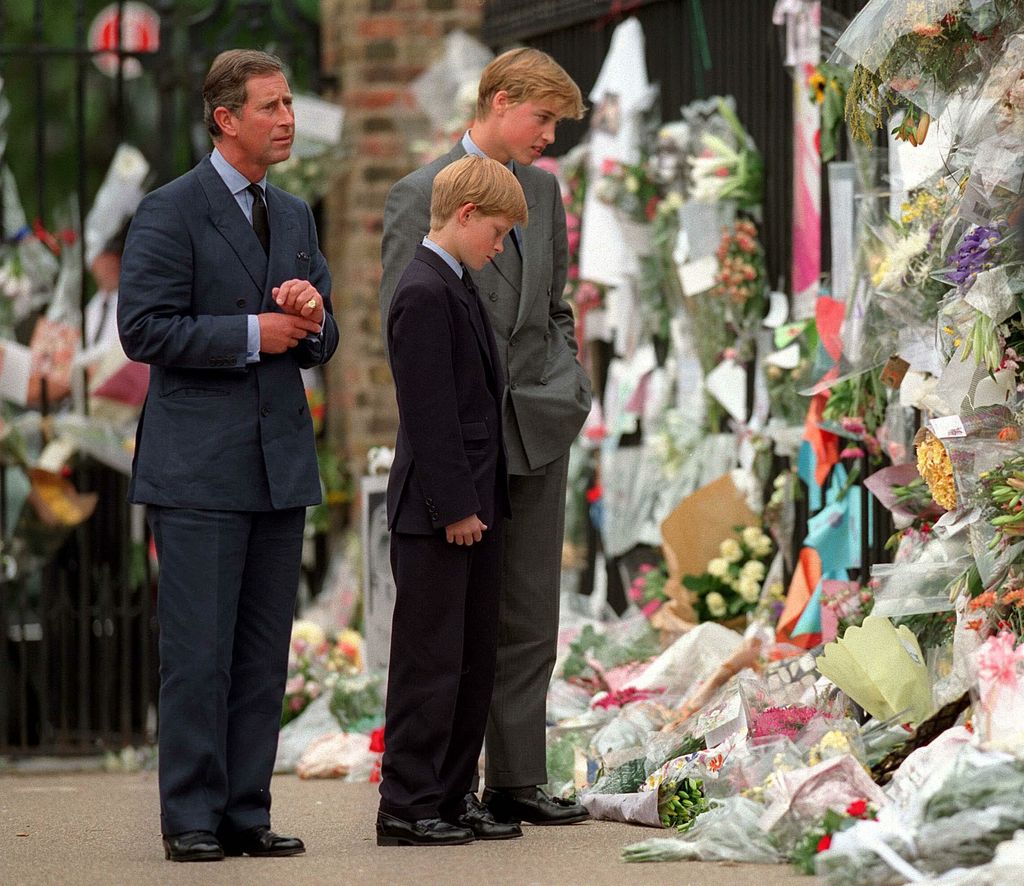 Charles, William and Harry view floral tributes to Diana, Princess of Wales outside Kensington Palace