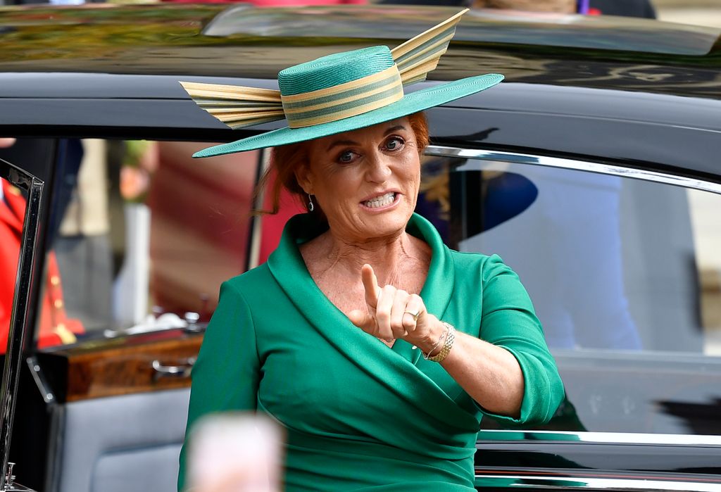 Sarah, Duchess of York in a green outfit as she pointed to crowds at Eugenie's wedding