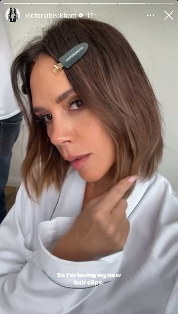 Victoris beckham with short chestnut bob and clips in her hair 