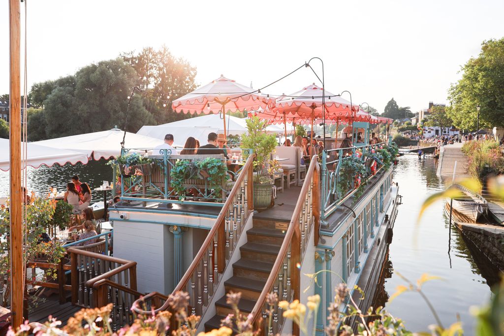 people eating on moored boat
