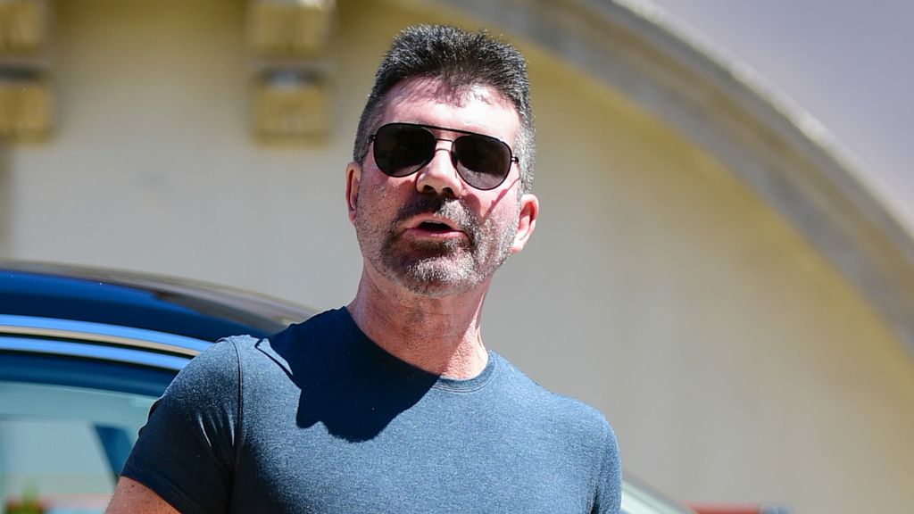 Simon Cowell in a navy T-shirt