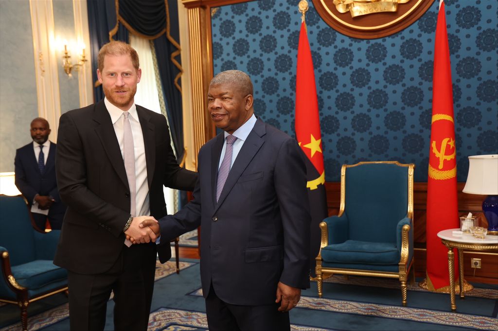 Prince Harry shaking hands with Angola's President Lourenço
