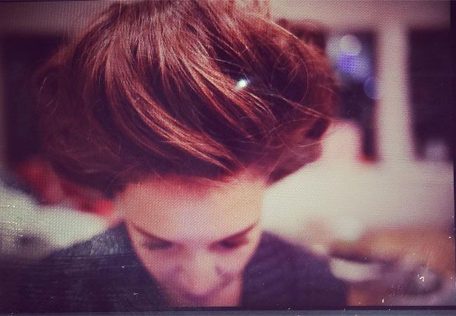 Katie Holmes shows off big hair on Instagram
