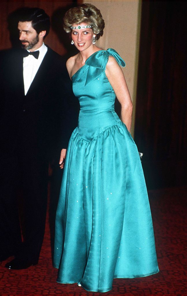 Princess Diana in blue dress with choker on forehead