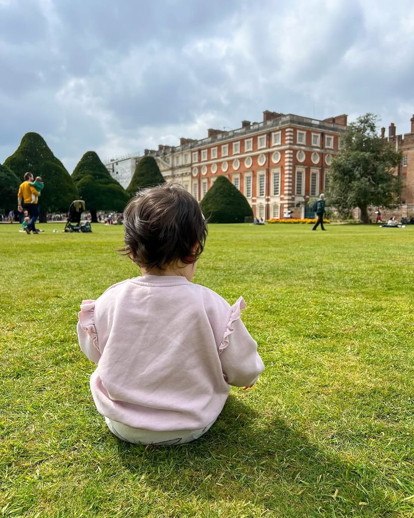 Emily Andre's daughter Arabella looking away from the camera at Hampton Court Palace